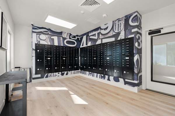 A wall of lockers with numbers on them. at AVIA Lofts on Parkway, Vancouver